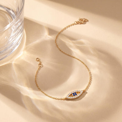 14K gold evil eye bracelet, styled view
