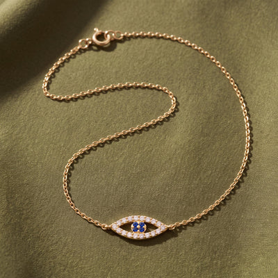 14K gold evil eye bracelet, styled view