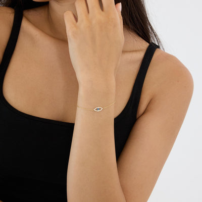 14K gold evil eye bracelet, styled view