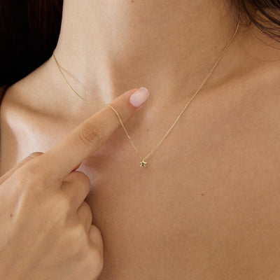 14K gold five point star pendant necklace, styled view