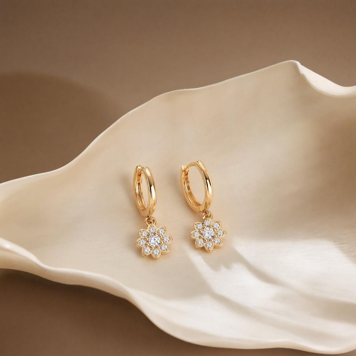 14K gold floral huggies earrings, styled view