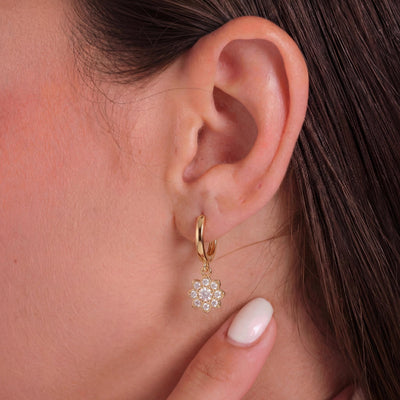 14K gold floral huggies earrings, styled view