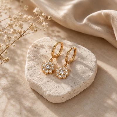14K gold floral huggies earrings, styled view