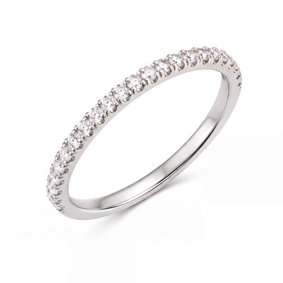 14K white gold half eternity ring with a row of round cubic zirconia, angled view on white