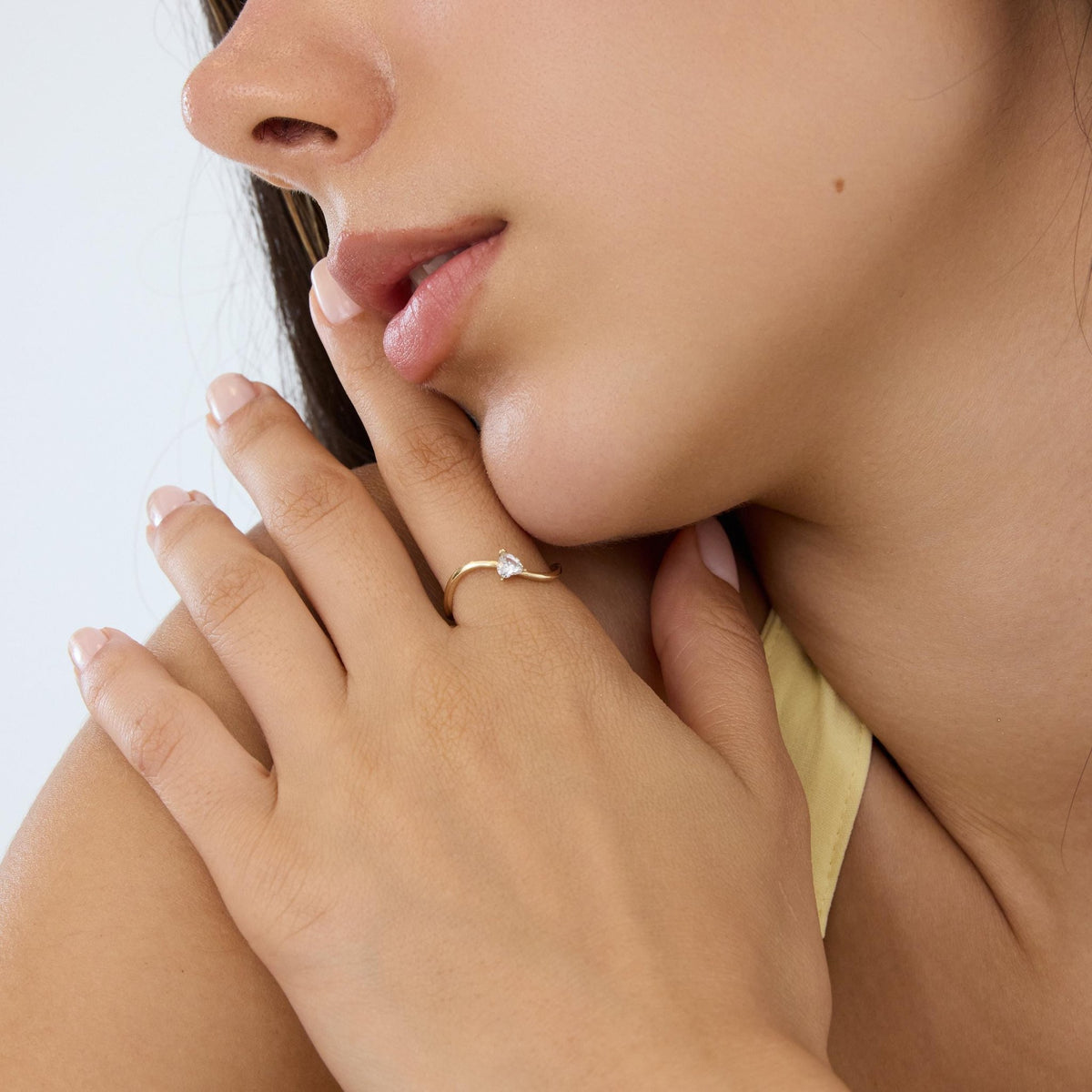 14K gold heart-shaped ring, styled view
