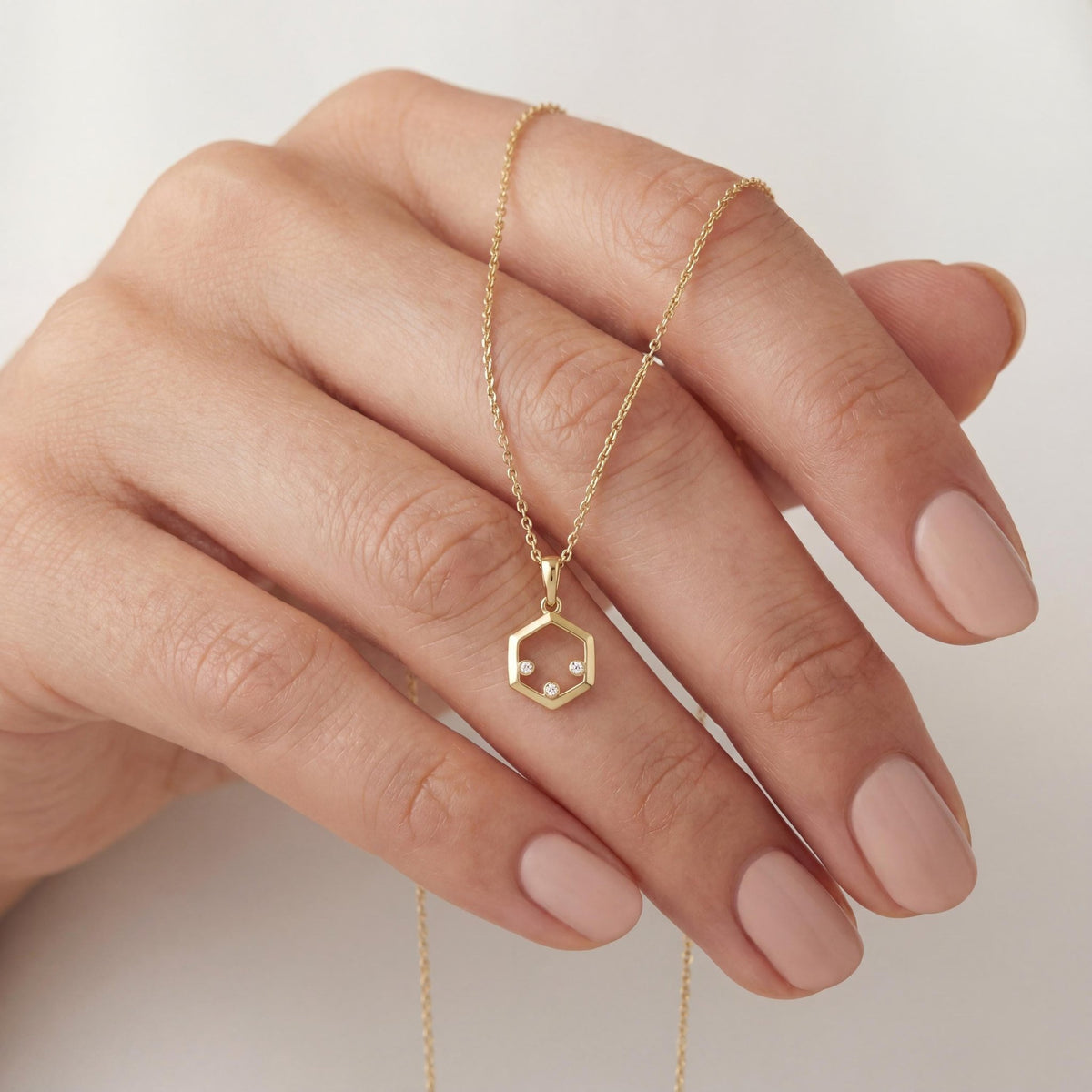 14K gold hexagon zirconia necklace, styled view