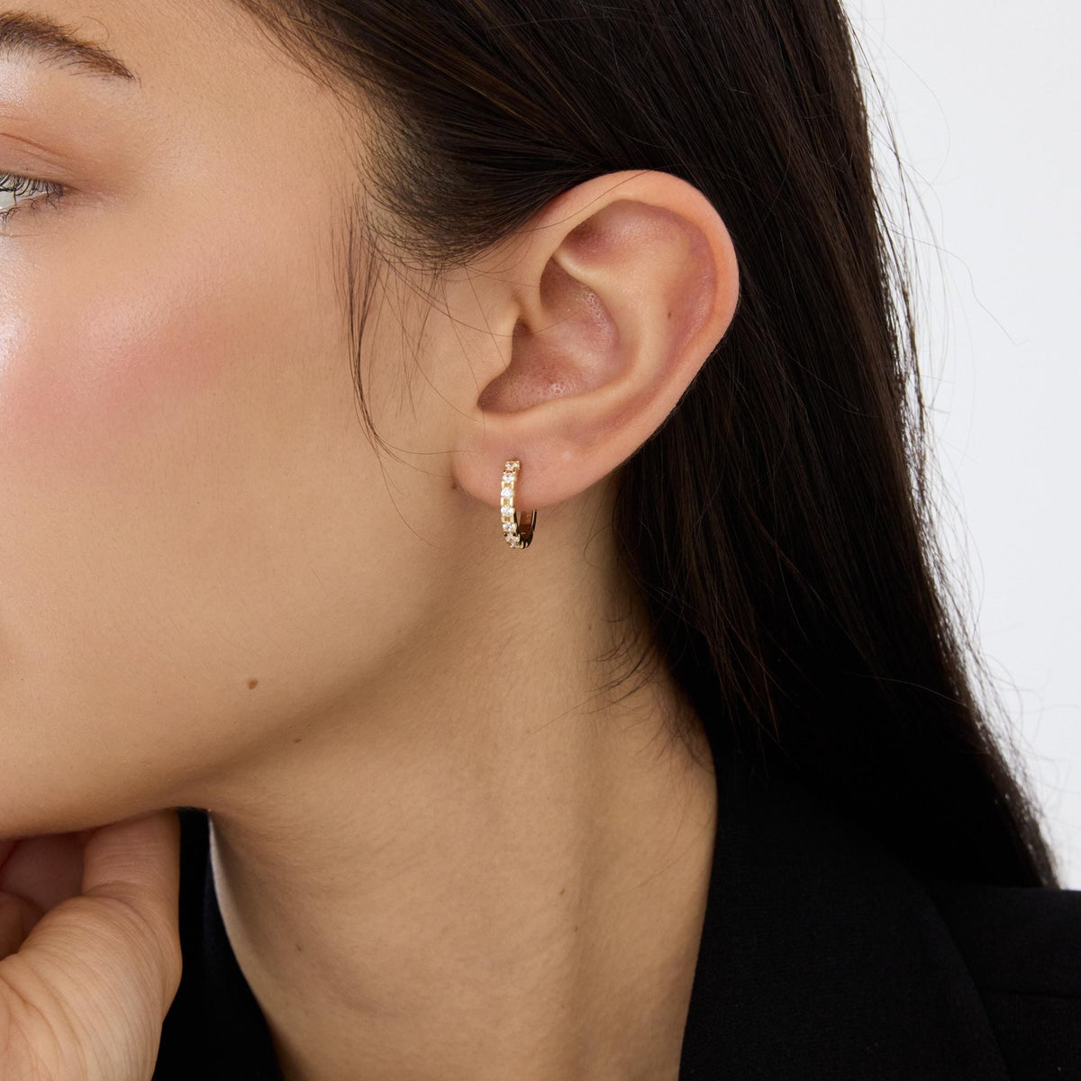 14K gold huggie hoop earrings, styled view