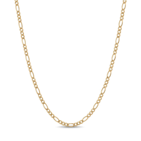 14K yellow gold figaro chain necklace, three short links and one long link pattern, draped on white