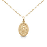 14K yellow gold Miraculous Medal necklace, oval medal with Virgin Mary relief and lettered border, on white