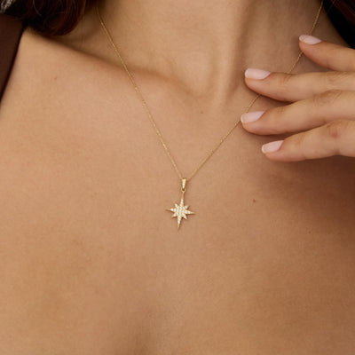 14K gold north star necklace, styled view