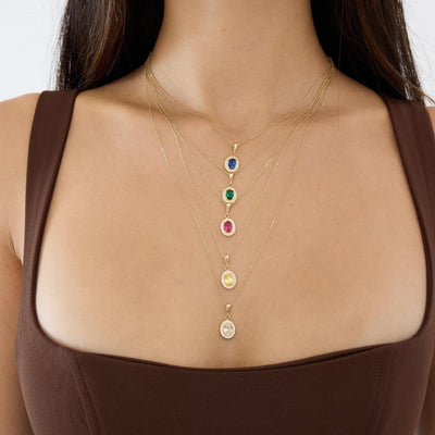 14K gold oval halo pendant necklace, styled view