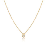 14K yellow gold pear drop necklace, small teardrop pendant with a bezel-set clear stone, on white