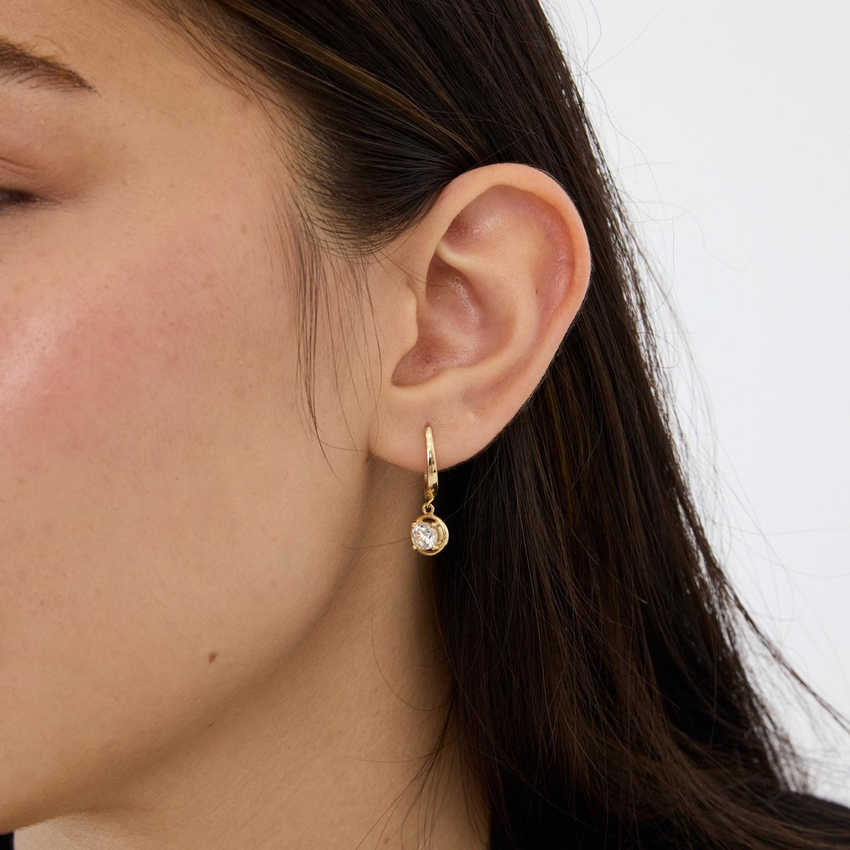 14K gold round cz solitaire drop hoop earrings, styled view