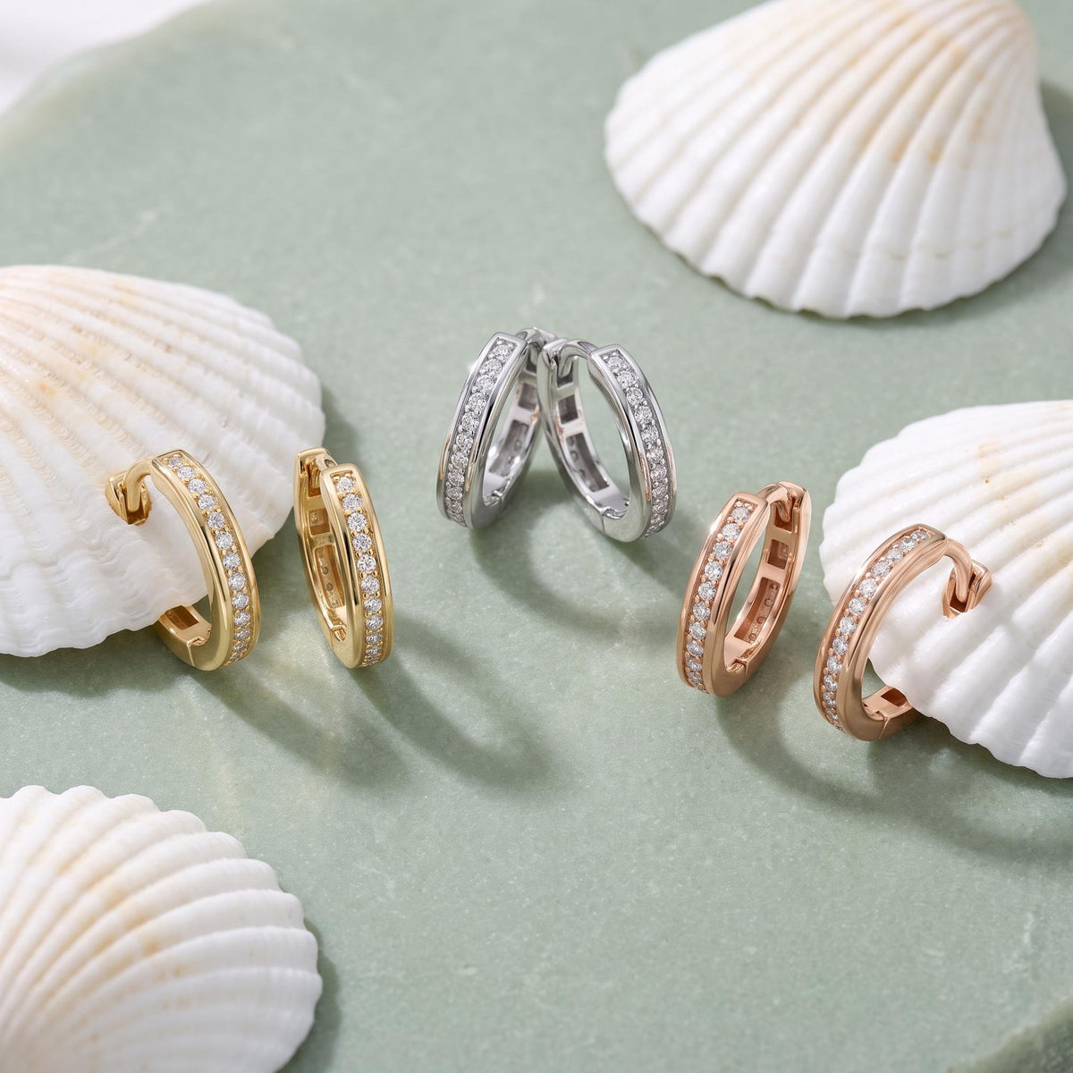 14K yellow, white and rose gold square huggie hoop earrings with cubic zirconia, three pairs among seashells