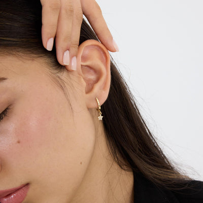 14K gold star hoop earrings, styled view