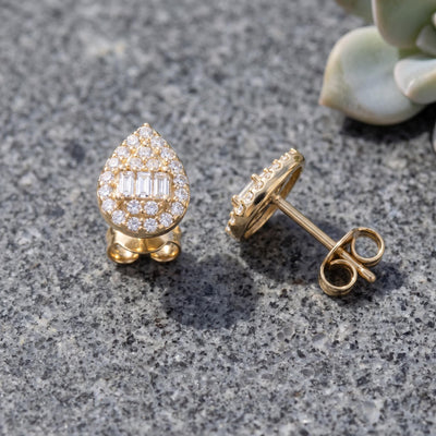 14K gold teardrop stud earrings styled on a neutral backdrop