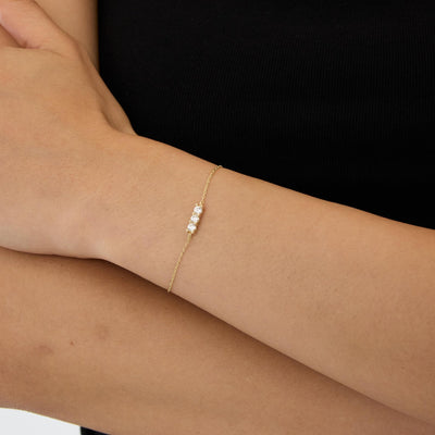 14K gold three stone bracelet, styled view