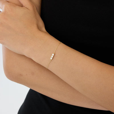 14K gold three stone bracelet, styled view