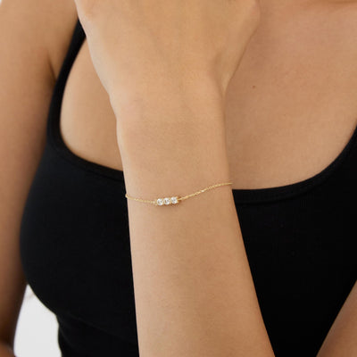 14K gold three stone bracelet, styled view