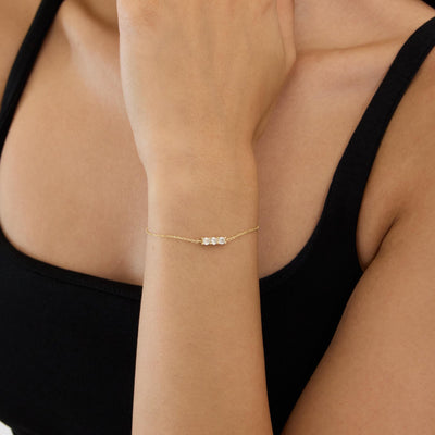 14K gold three stone bracelet, styled view
