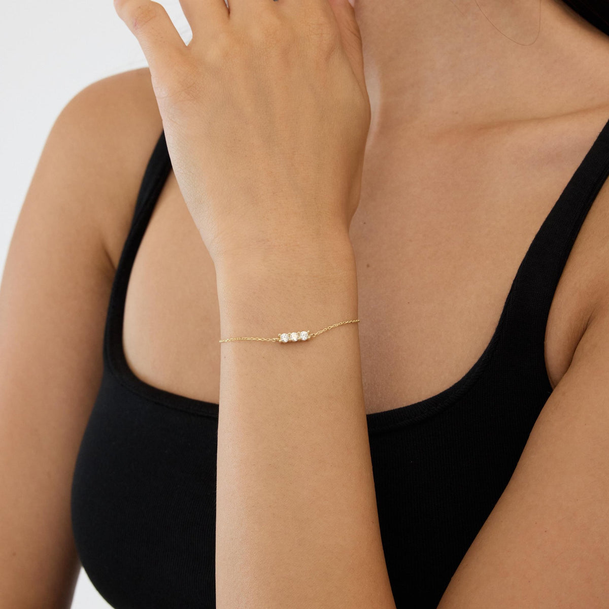 14K gold three stone bracelet, styled view