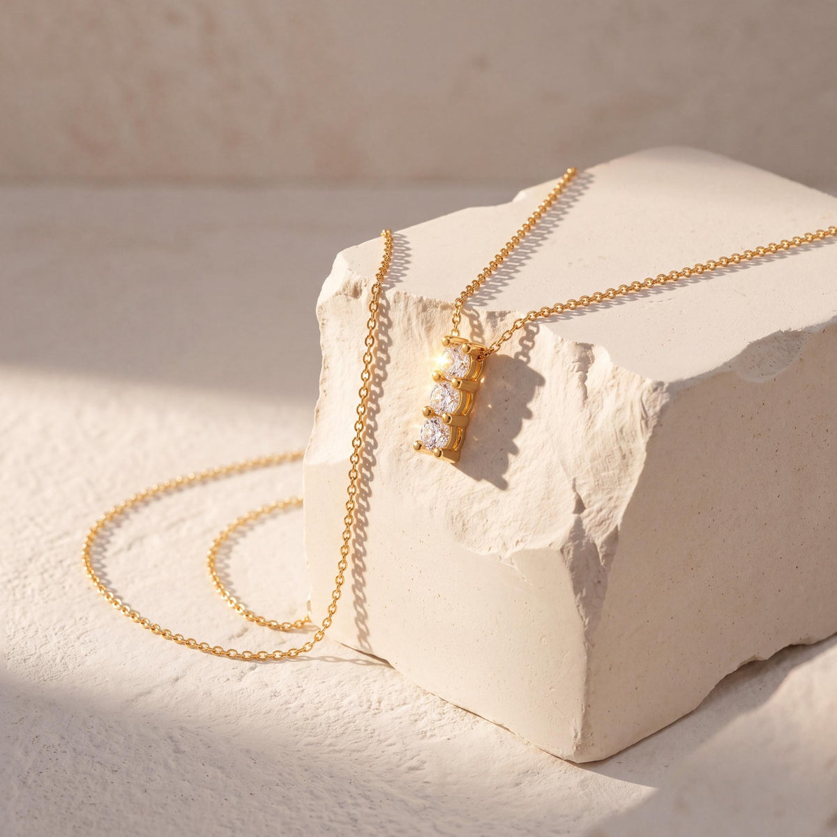 14K gold three stone necklace, styled view