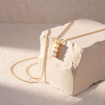 14K gold three stone necklace, styled view
