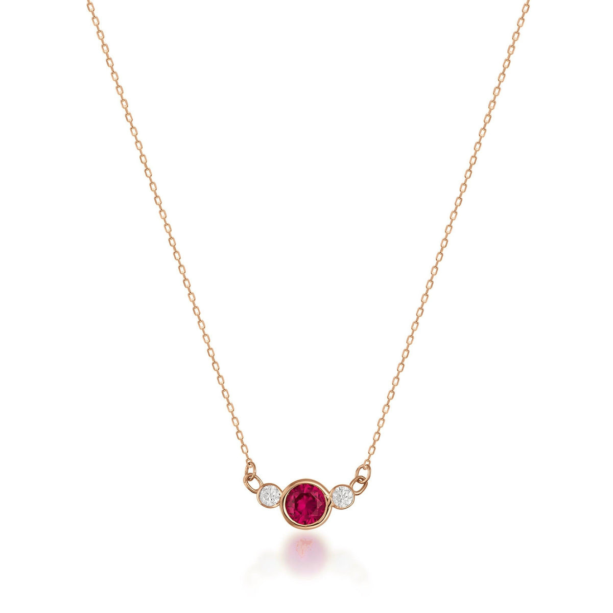 14K gold necklace with a round red Simulated Ruby and two small cubic zirconia on a delicate chain